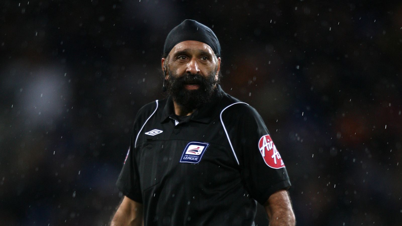 PA - Jarnail Singh refereeing a Championship match between Cardiff City and Ipswich Town in 2009