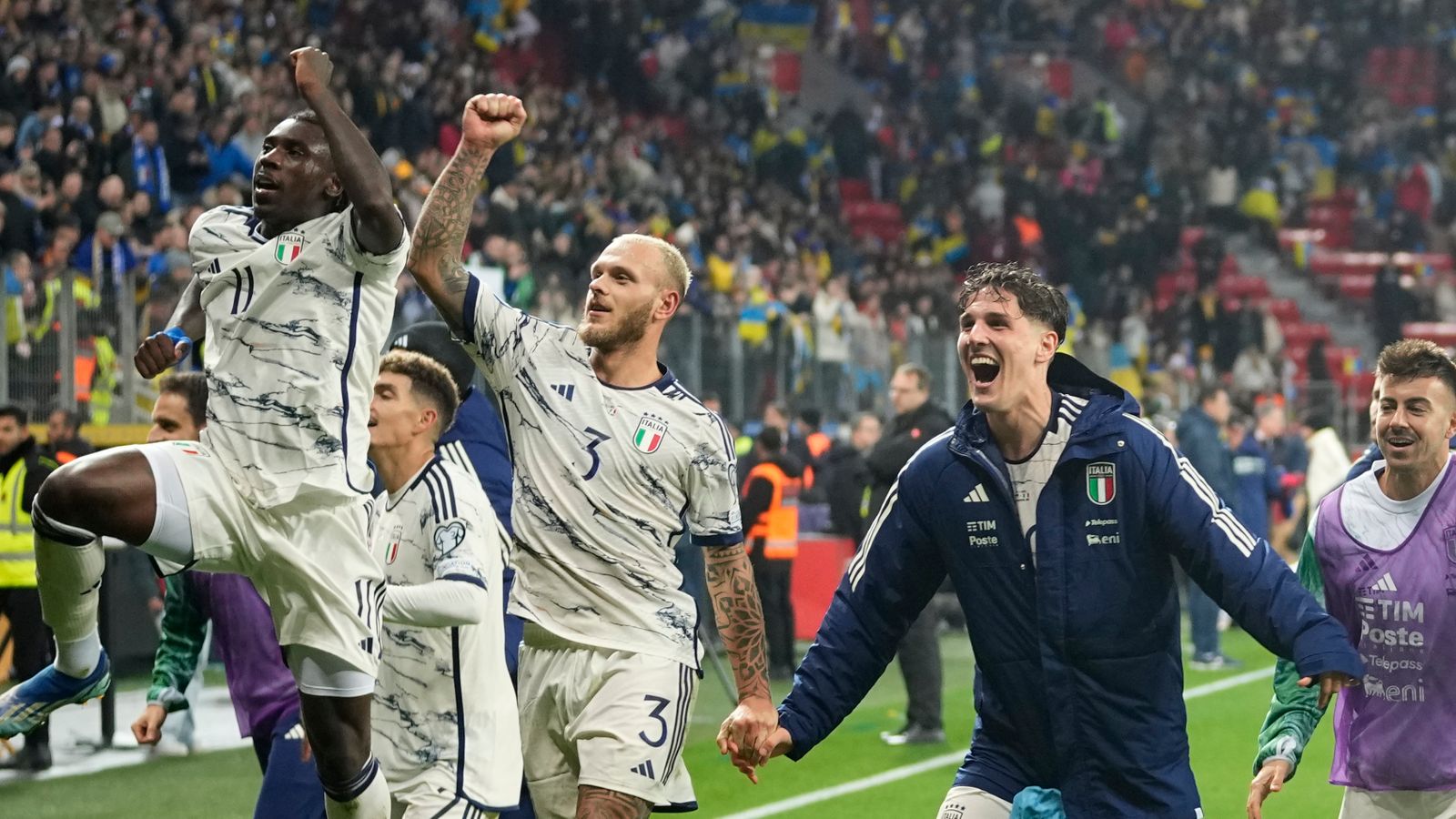 Italy players celebrate their qualifying after the Euro 2024 group C qualifying soccer match between Ukraine and Italy at the BayArena in Leverkusen, Germany, Monday, Nov. 20, 2023. (AP Photo/Martin Meissner)
